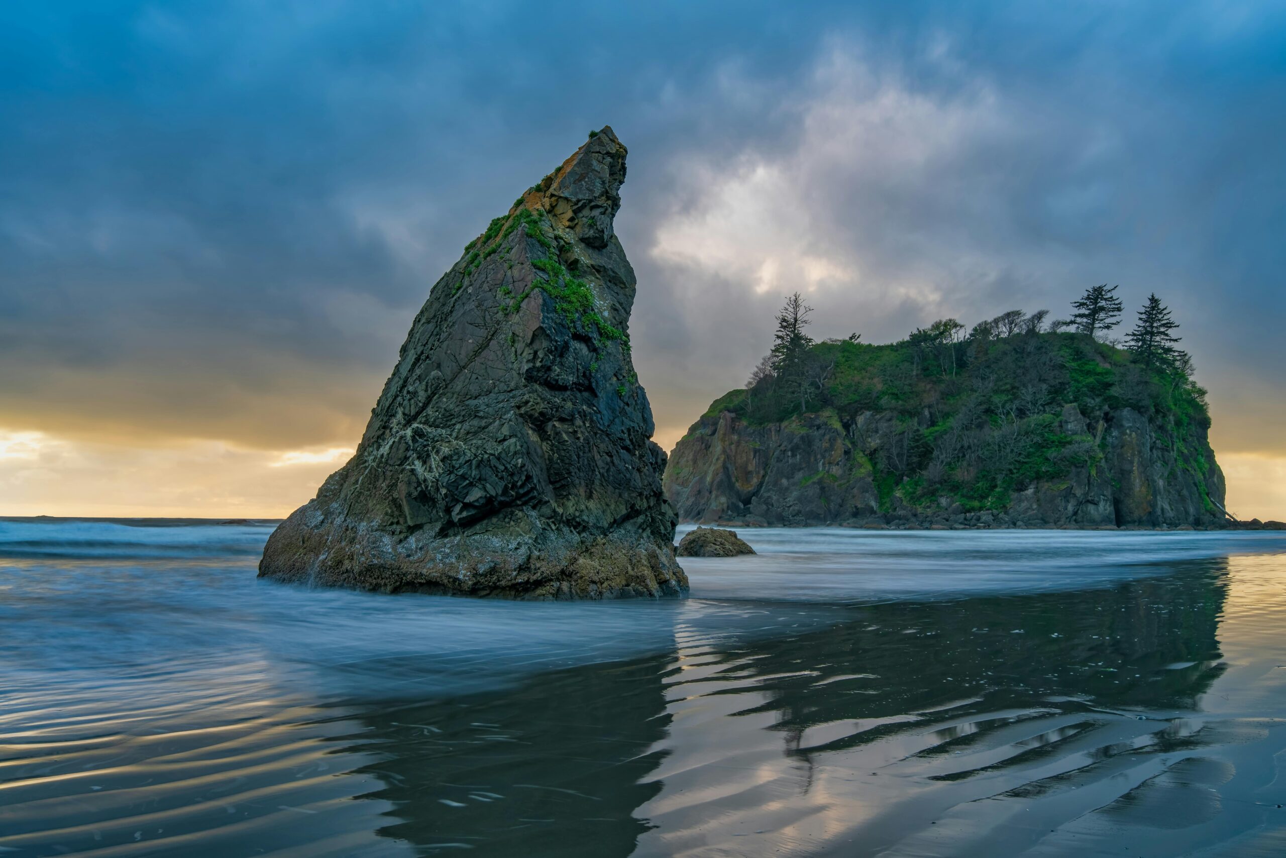 Stunning sunset view of rock formations and ocean at Ruby Beach, Washington.